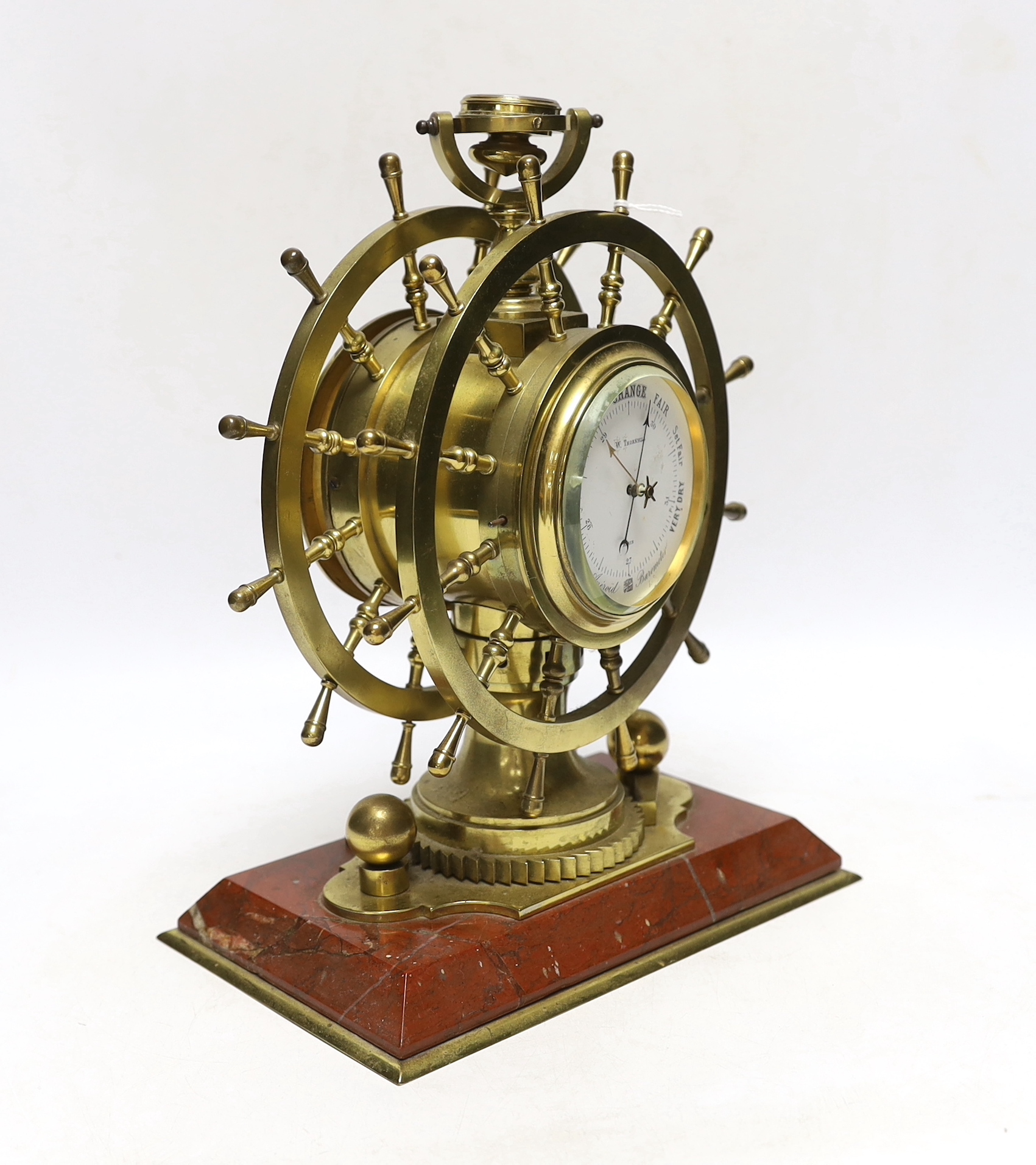 A late Victorian brass and marble ship's wheel timepiece with aneroid barometer and compass, 29.5cm